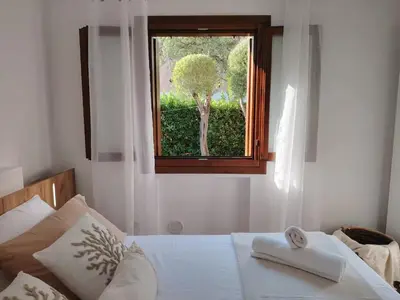 Letto o letti in una camera di La Bougainville Garden & Pool