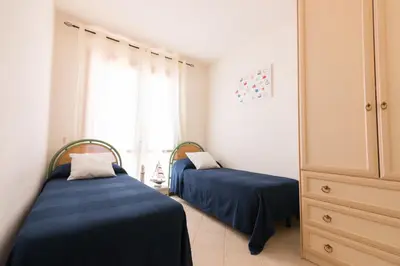 Letto o letti in una camera di SardegnaSummer Il Borgo Porto San Paolo
