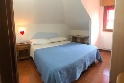 Letto o letti in una camera di Milou Home vicino Ospedale S Francesco
