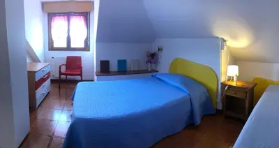 Letto o letti in una camera di Milou Home vicino Ospedale S Francesco
