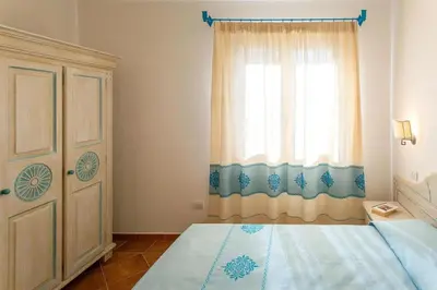 Letto o letti in una camera di Charming Baia Marina 1 bedroom premier Apartments with Terrace balcony sleeps 4