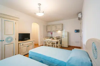 Letto o letti in una camera di Charming Baia Marina 1 bedroom premier Apartments with Terrace balcony sleeps 4