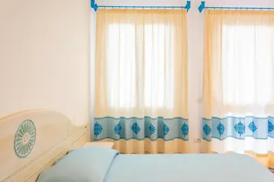 Letto o letti in una camera di Charming Baia Marina apartment with Stunning View 1 bedroom apartment sleeps 4