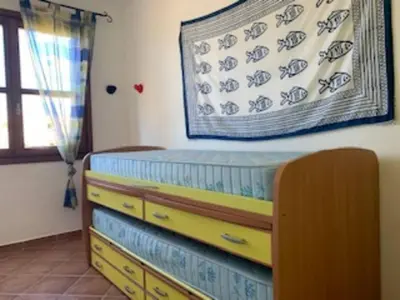 Letto o letti in una camera di CASA MARE Olbia