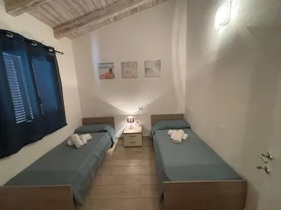 Letto o letti in una camera di Alba Vista Mare - Apartment mit Meerblick und Pool Budoni, Sardinien