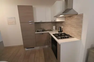 Cucina o angolo cottura di Alba Vista Mare - Apartment mit Meerblick und Pool Budoni, Sardinien