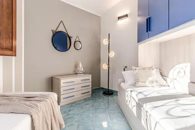 Letto o letti in una camera di Villetta Baia Sant Anna