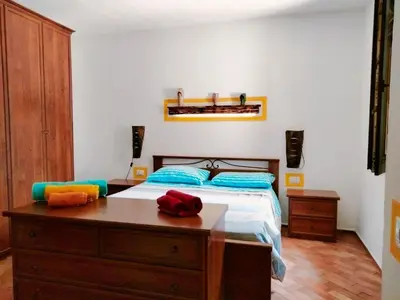 Letto o letti in una camera di Casa Rustica