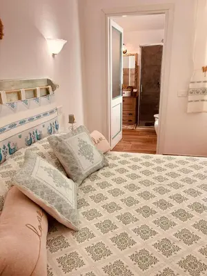Letto o letti in una camera di Casa Tholos Charme and Relax