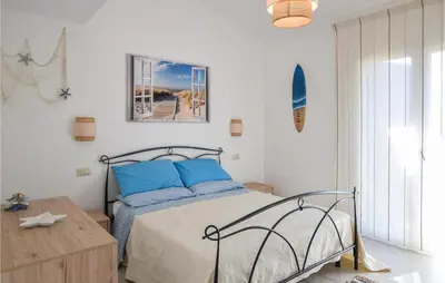Letto o letti in una camera di Domo Sa Maggie