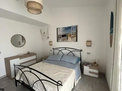 Letto o letti in una camera di Domo Sa Maggie
