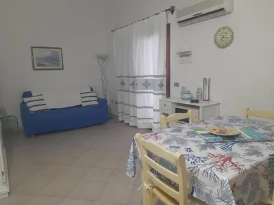 Letto o letti in una camera di Villetta Smeraldo con giardino