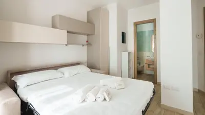 Letto o letti in una camera di Urban Pearl