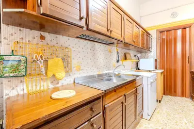 Cucina o angolo cottura di - Olbia City Center - Regina Margherita Apartment