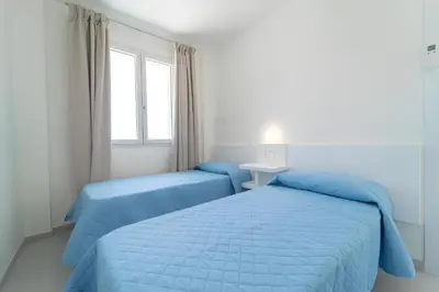 Letto o letti in una camera di Luxi by NG Collection