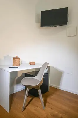 TV o dispositivi per l'intrattenimento presso My Holiday Olbia Rooms&Lounge by Rentbeat