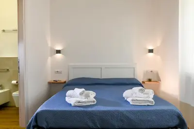 Letto o letti in una camera di My Holiday Olbia Rooms&Lounge by Rentbeat