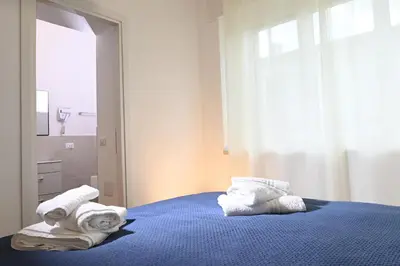 Letto o letti in una camera di My Holiday Olbia Rooms&Lounge by Rentbeat