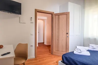 Letto o letti in una camera di My Holiday Olbia Rooms&Lounge by Rentbeat