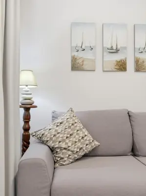 Area soggiorno di Residence Moresca , Appartamento Tavolara con Giardino e Vista Mare a 80 mt dalla Spiaggia
