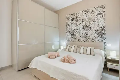 Letto o letti in una camera di Residence Moresca , Appartamento Tavolara con Giardino e Vista Mare a 80 mt dalla Spiaggia