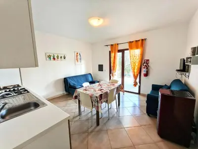 Area soggiorno di Comfortable apartment near Budoni