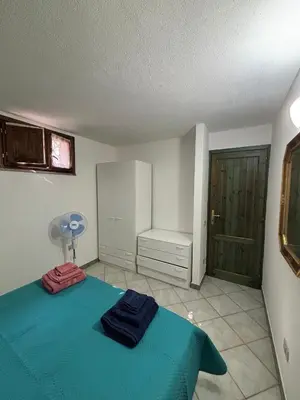 Letto o letti in una camera di Casa Andrea