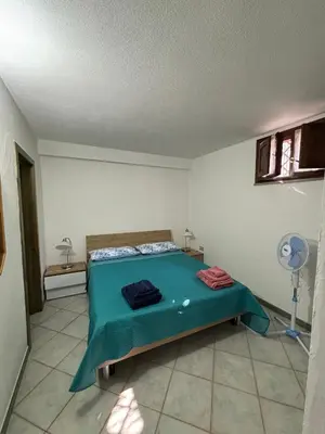Letto o letti in una camera di Casa Andrea