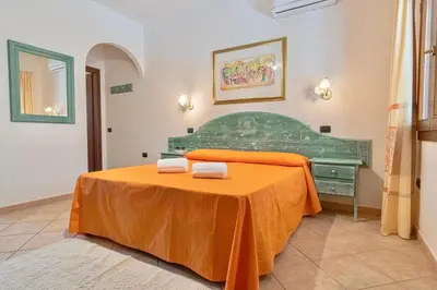 Letto o letti in una camera di Residence Cala Viola