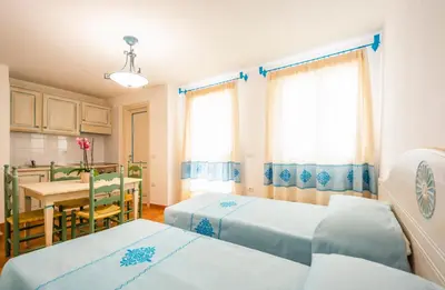 Letto o letti in una camera di Appartamenti Baia Marina