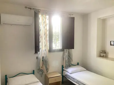 Letto o letti in una camera di Olivastro