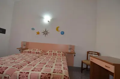 Letto o letti in una camera di APT 800 METRI Spiaggia Agrustos 2 PAX