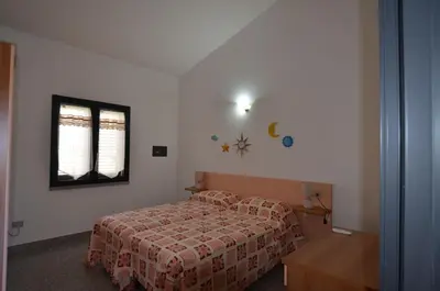 Letto o letti in una camera di APT 800 METRI Spiaggia Agrustos 2 PAX