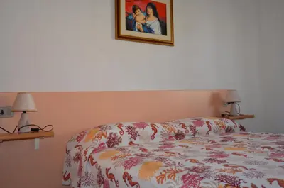Letto o letti in una camera di APT 800 METRI Spiaggia Agrustos 2 PAX