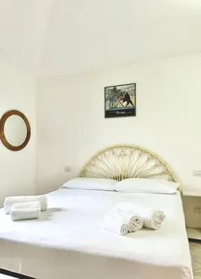 Letto o letti in una camera di Casa Arturo