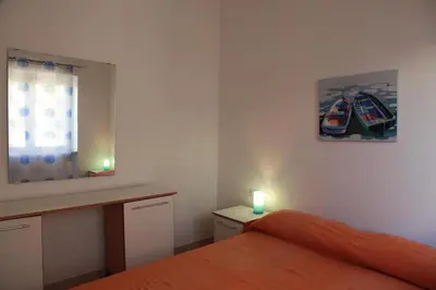 Letto o letti in una camera di Viva Houses San Teodoro