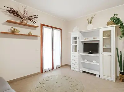 TV o dispositivi per l'intrattenimento presso Monte Ruju Apartment by Residence Moresca