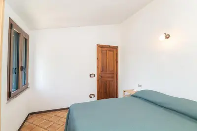 Letto o letti in una camera di Villa La Dolce Teodoro - Spacious Family Villa Near Beaches & Center