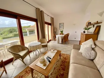Area soggiorno di ISA - Luxury apartment Elicriso sea view with common swimming pool just 100 mt from the beach
