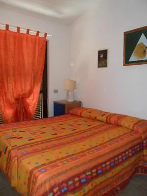 Letto o letti in una camera di Appartamenti Village Ottiolu