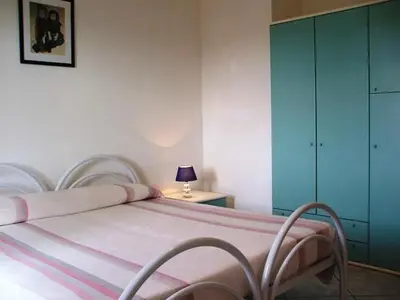 Letto o letti in una camera di Appartamenti Village Ottiolu
