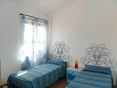 Letto o letti in una camera di Appartamenti Village Ottiolu