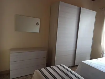 Letto o letti in una camera di Casa Vacanze AnnaLù IUN R5074