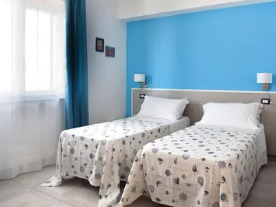 Letto o letti in una camera di San Teodoro Living House
