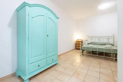 Letto o letti in una camera di Relaxing apartment close to Santa Lucia beach