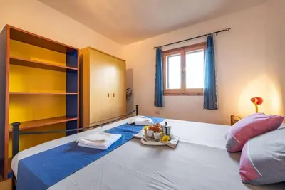Letto o letti in una camera di Cozy apartment 150m from Pittulongu beach