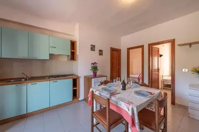 Cucina o angolo cottura di Perfectly located flat in San Teodoro