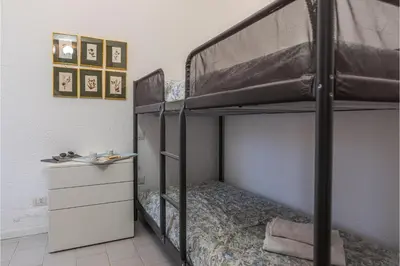 Letto o letti in una camera di Il Vecchio Faro Carolina - Happy Rentals