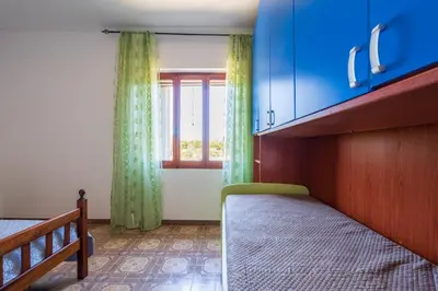 Letto o letti in una camera di Villa Antonina & Mino