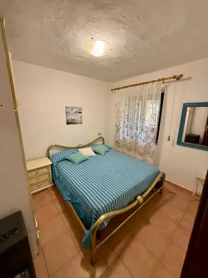 Letto o letti in una camera di Villa Melograno
